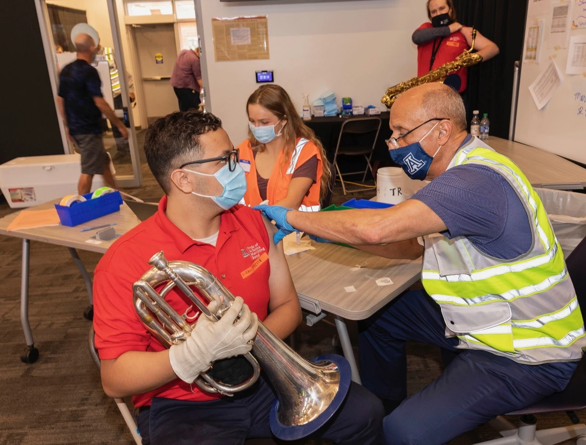 Picture of Band Student Being Vaccinated